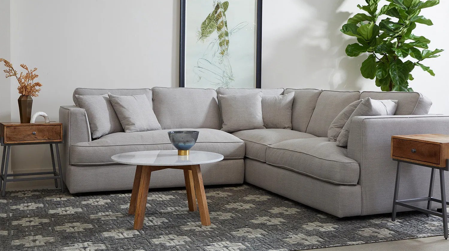 Living room decor with a light gray fabric sectional.