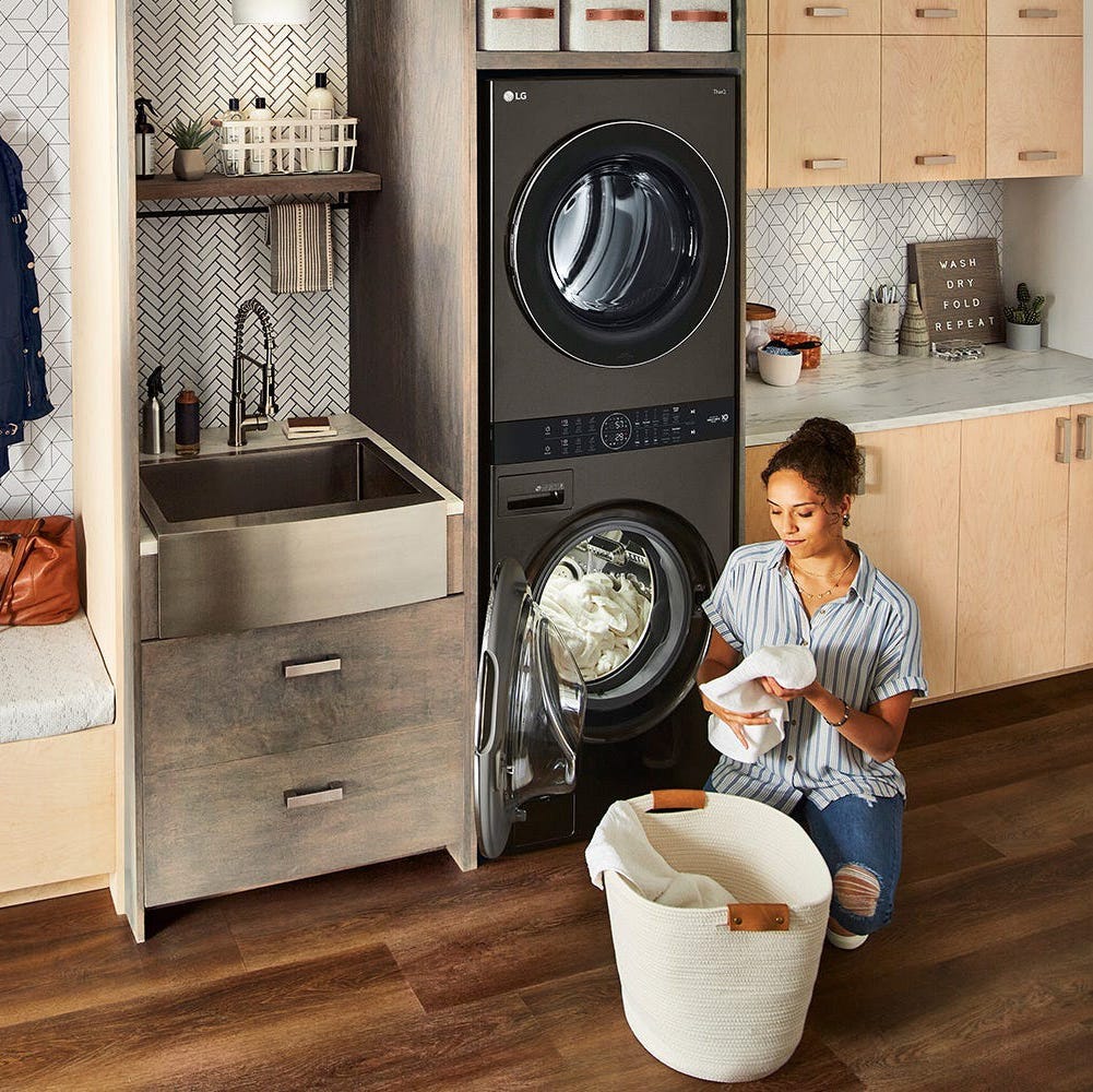 Gray stacked washer-dryer set in a laundry room